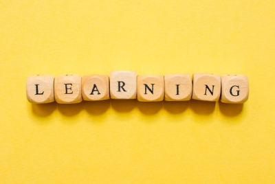 Wood pieces spelling out the word Learning.